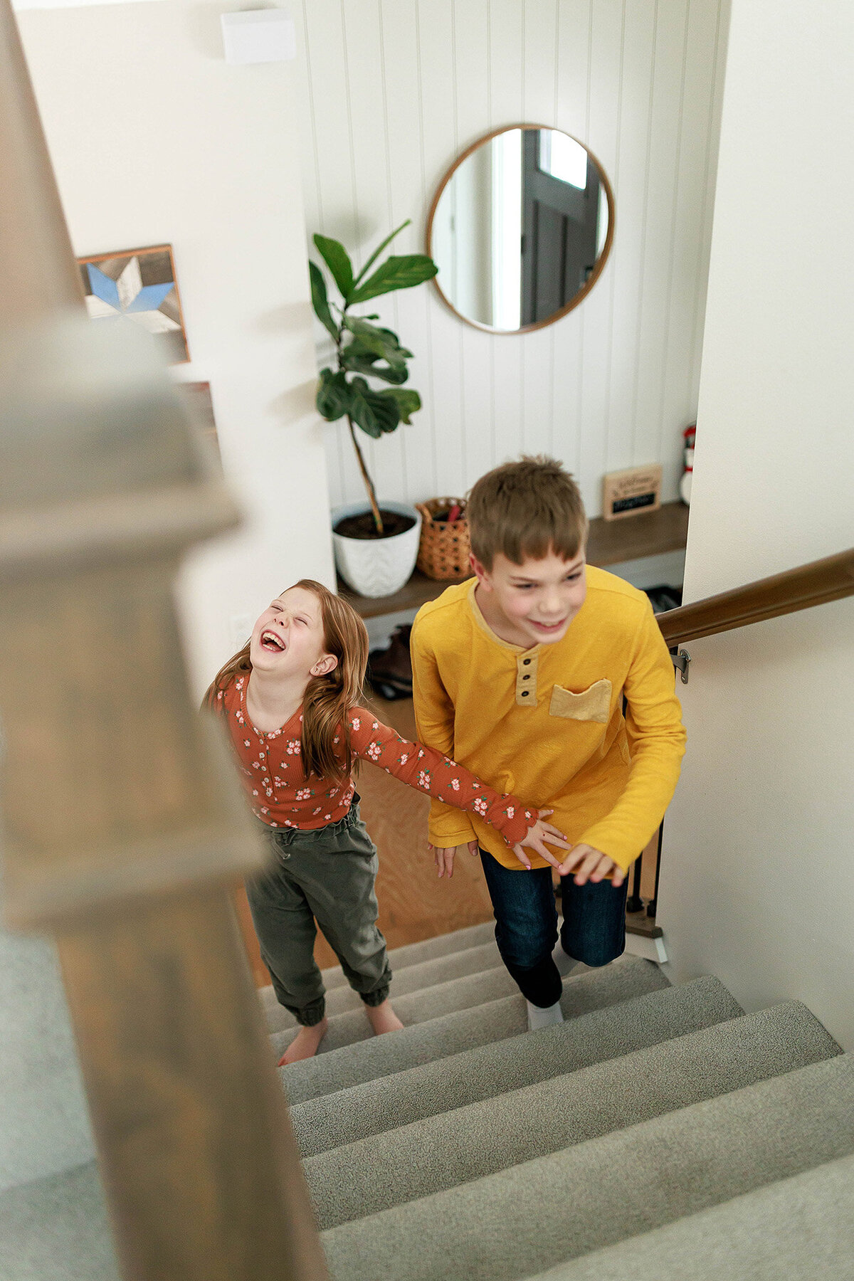 racing-siblings-on-stairs
