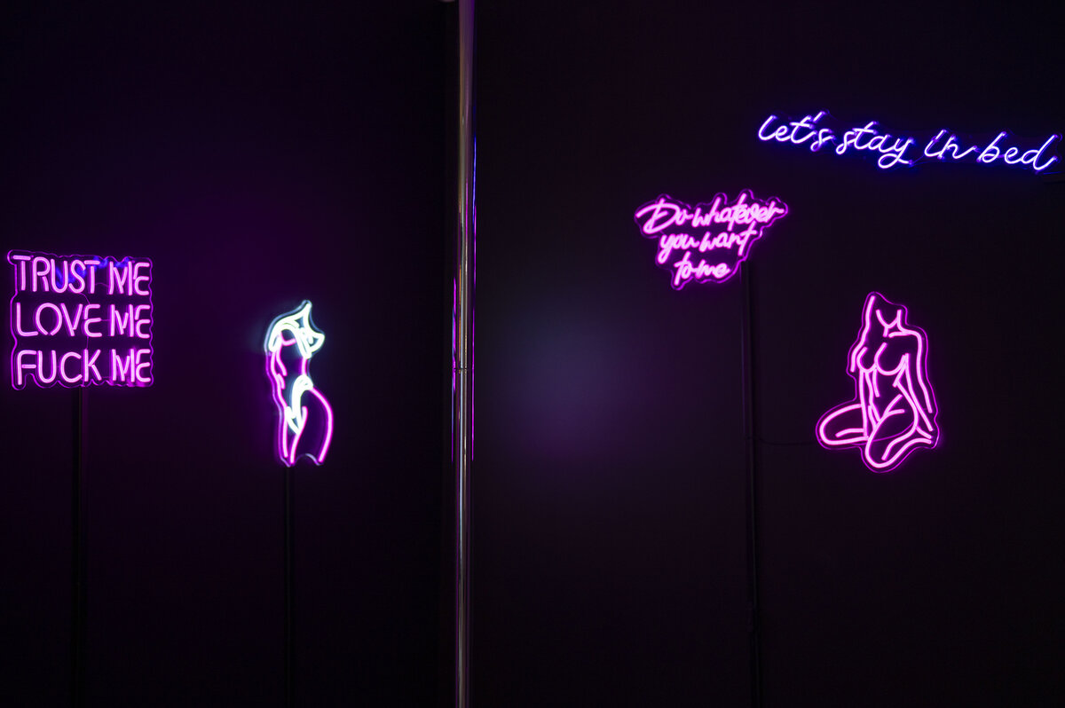 center stage strip club set, neon lights, dark and moody, sultry set