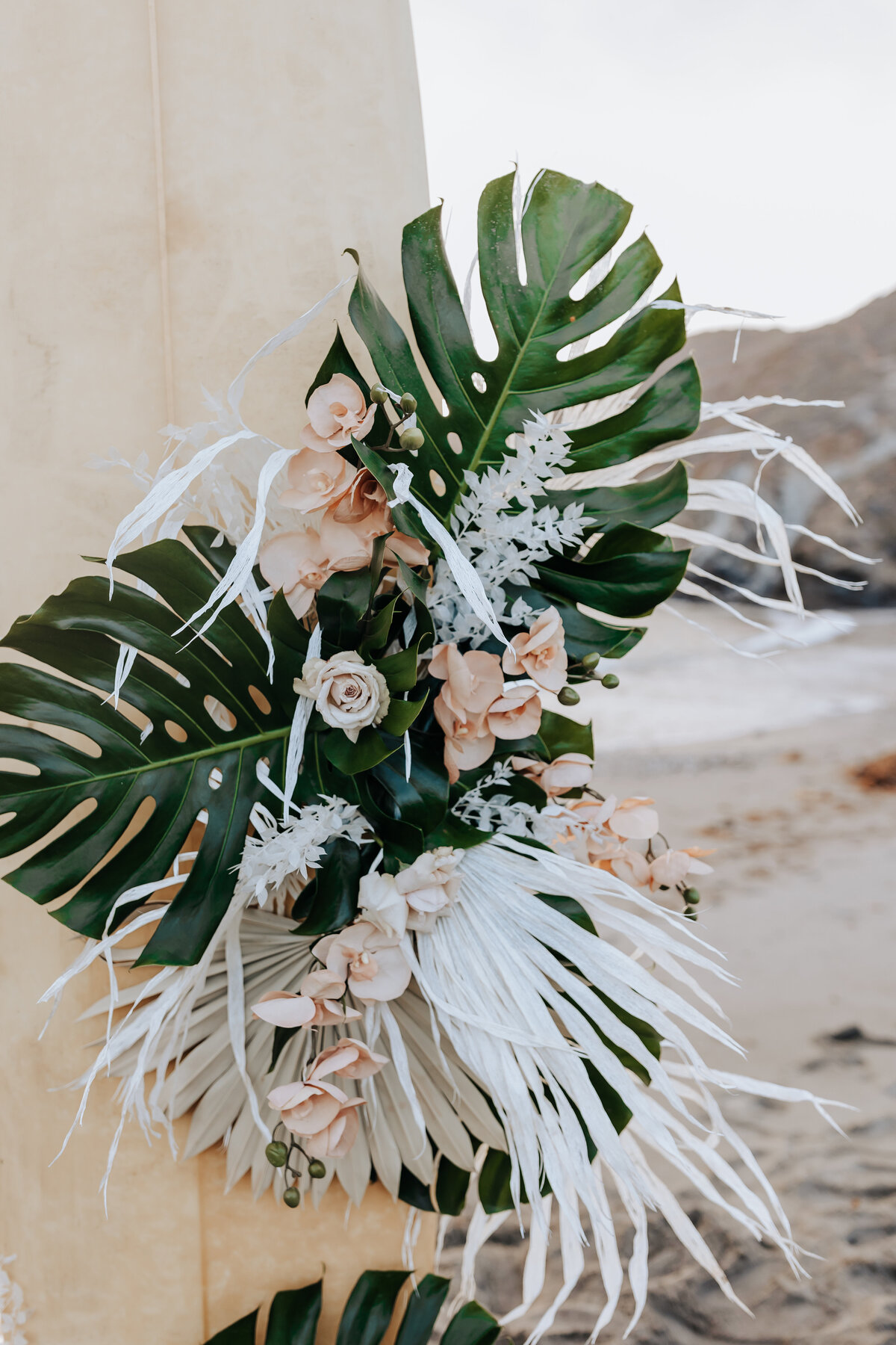 Destination elopement photographer captures palm tree wedding decor