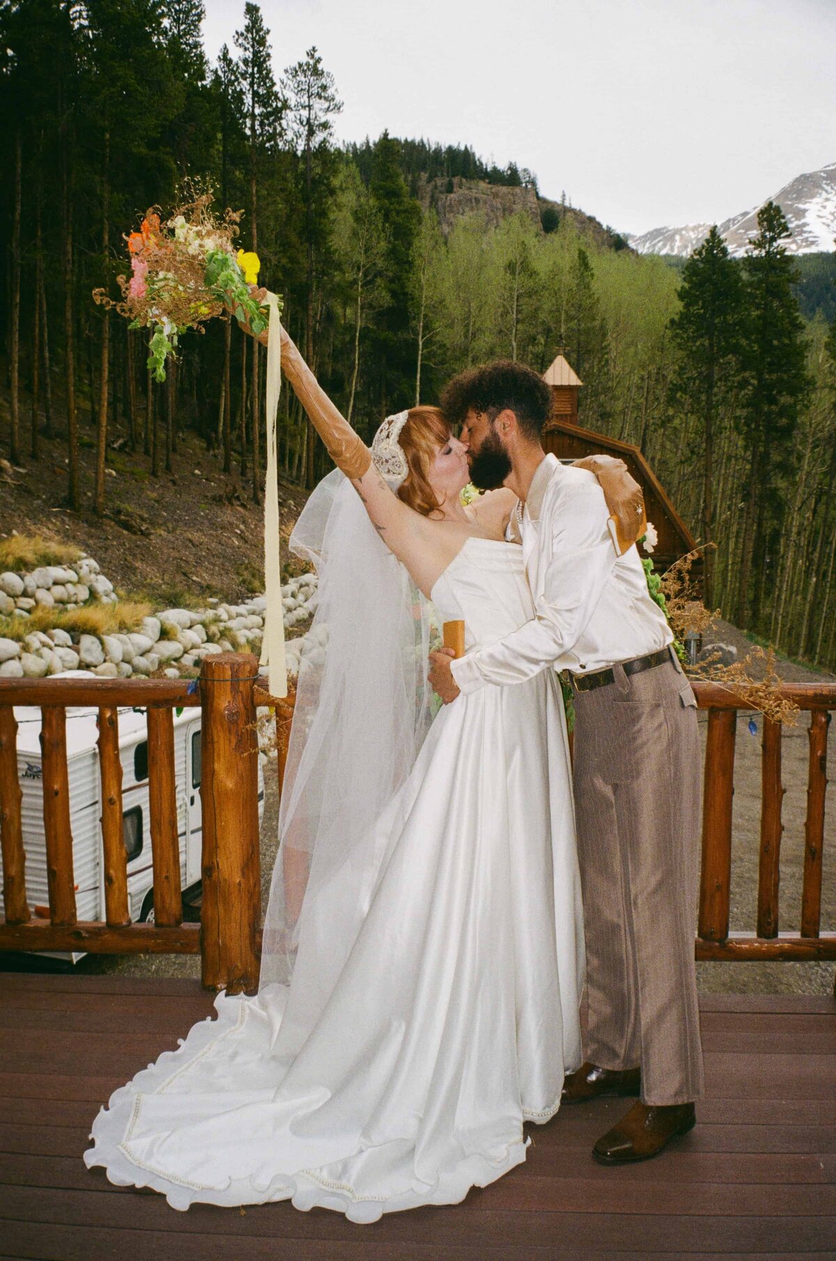 A bride and groom kiss during their elopement in Leadville, Colorado.