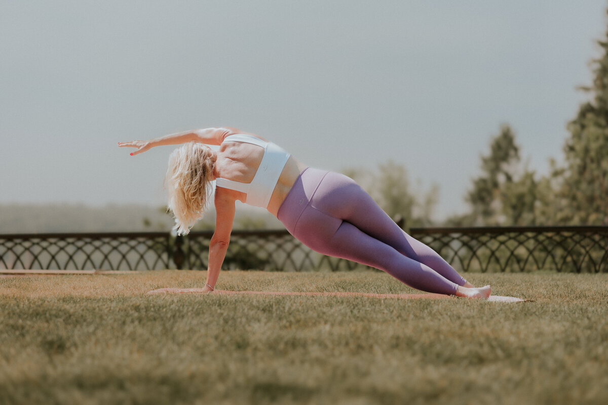 Outdoor yoga branding photo captured in natural light, highlighting a warm and welcoming yoga business.