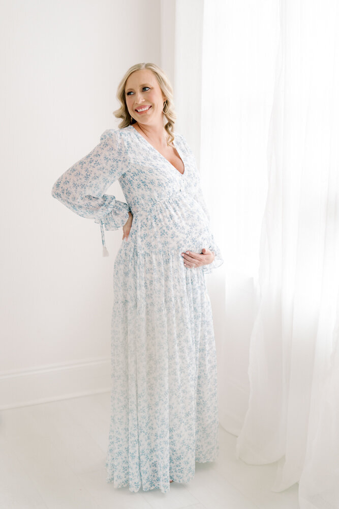 maternity-photos-blue-dress-in-white-studio