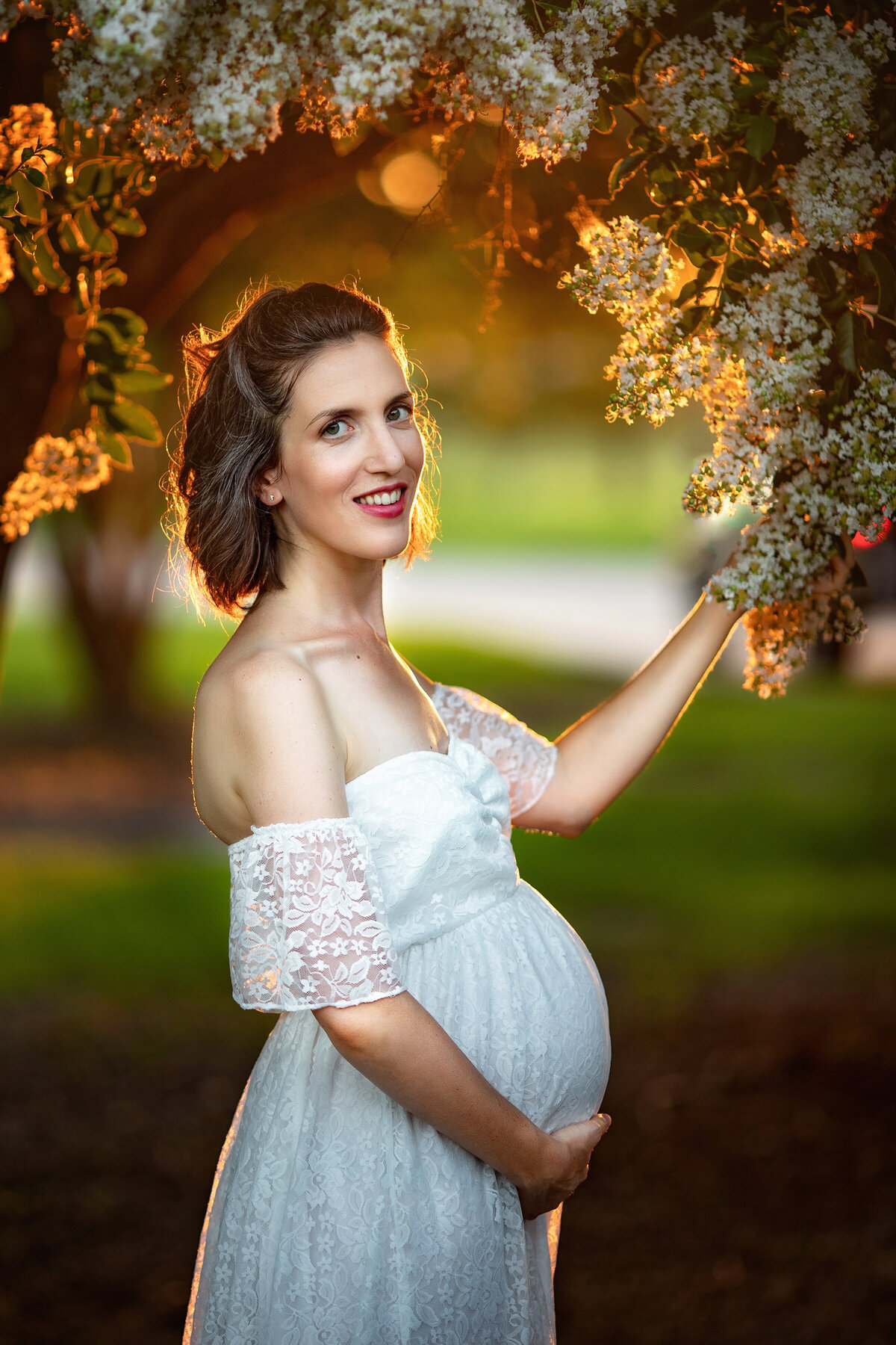 crepe myrtle white golden hour maternity new orleans flowers lace pregnant belly woman