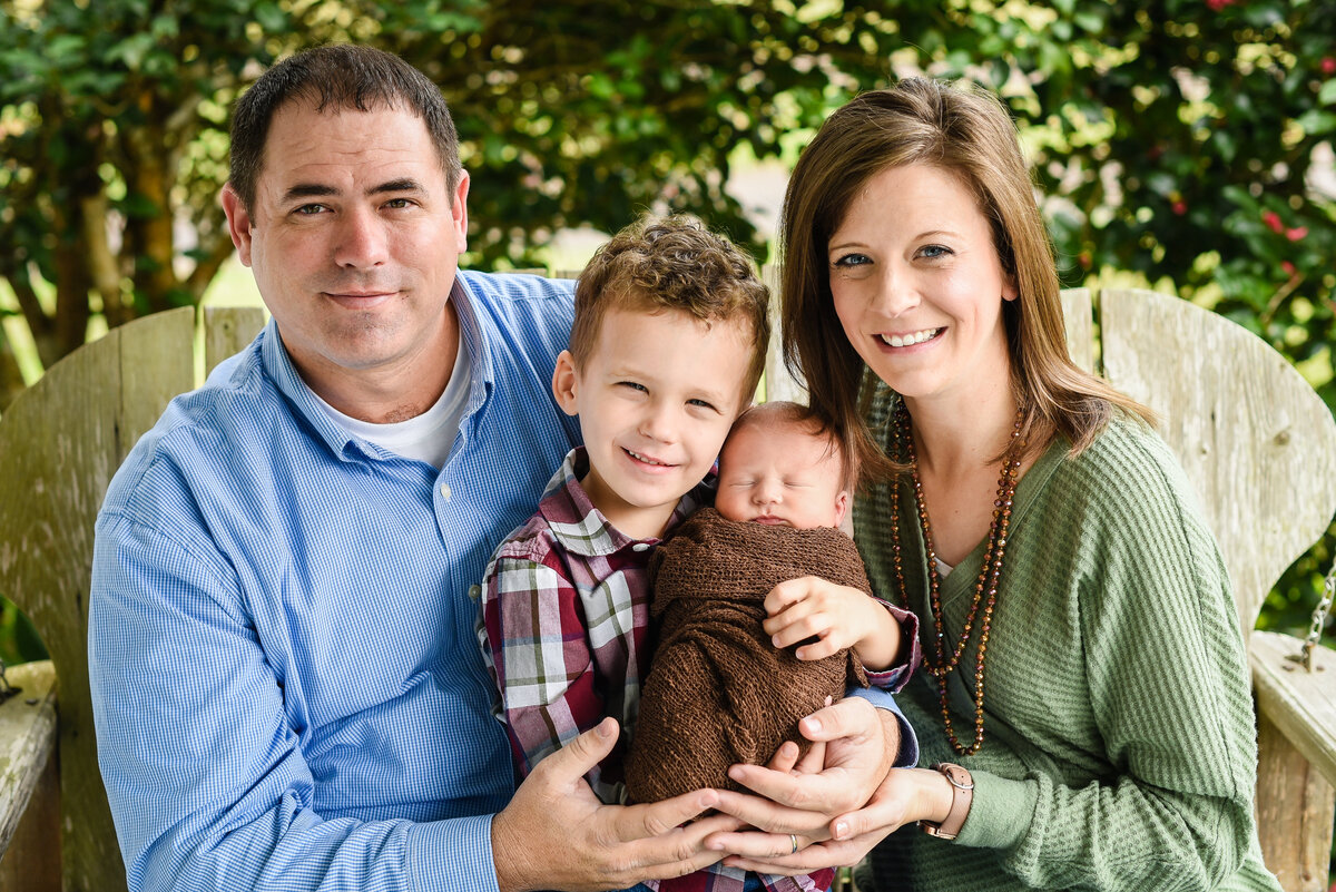 Beautiful Mississippi newborn photography: Family on Mississippi farm house porch swing with newborn baby boy