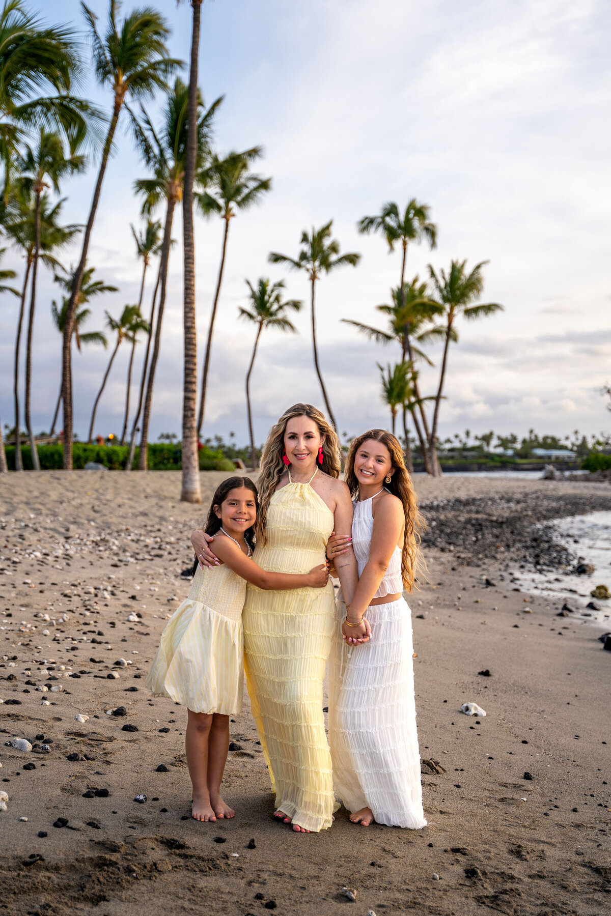 hawaii family portraits of mom with daughters on the beach, taken by Hawaii Adventure Portraits