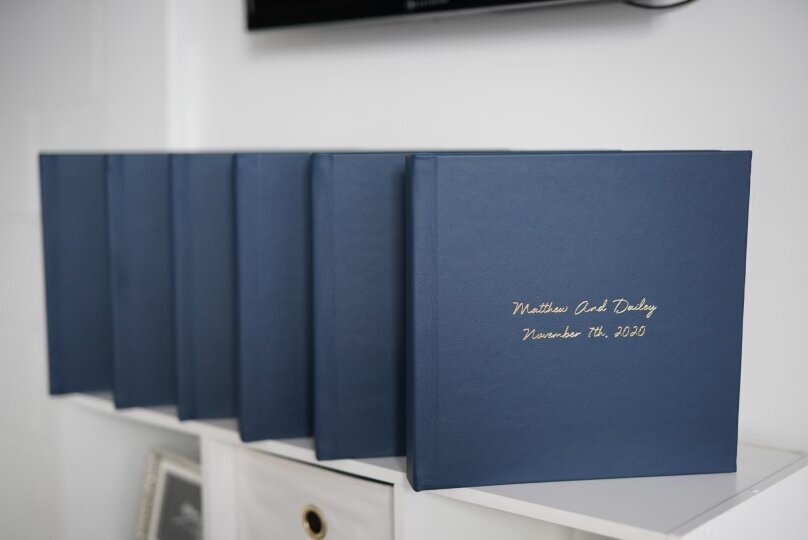 Wedding albums lined up on shelf by Nashville wedding photographer, Liz Courtney