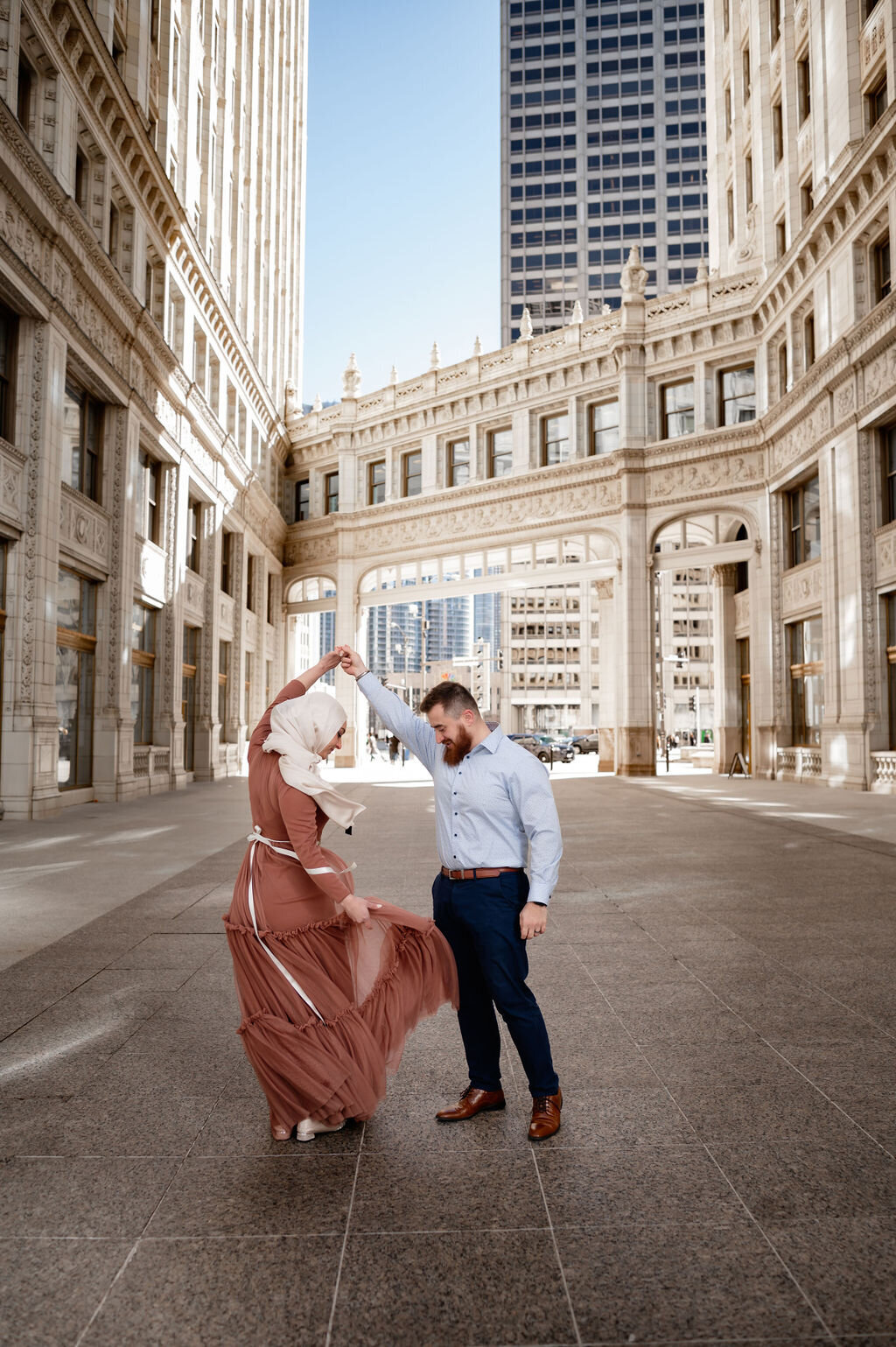 A muslim couple dance at the Wrigley Building in Chicago, IL