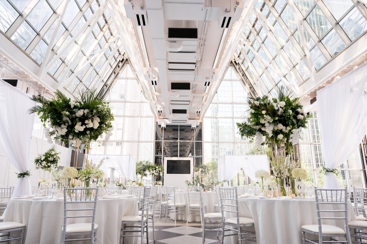 wedding reception at wintergarden ppg place with flowers designed by greensinner pittsburgh florist