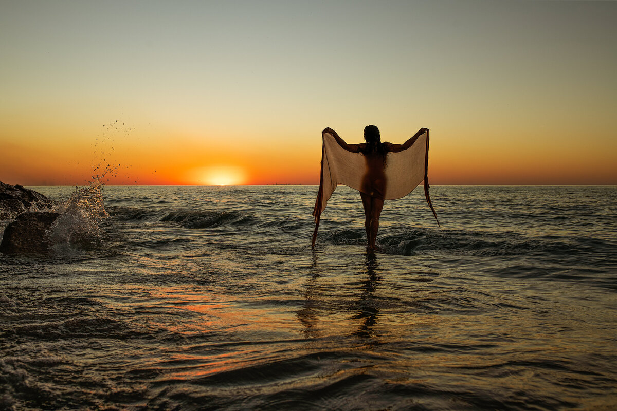 crashing waves on the rocks in lake Michigan with wings