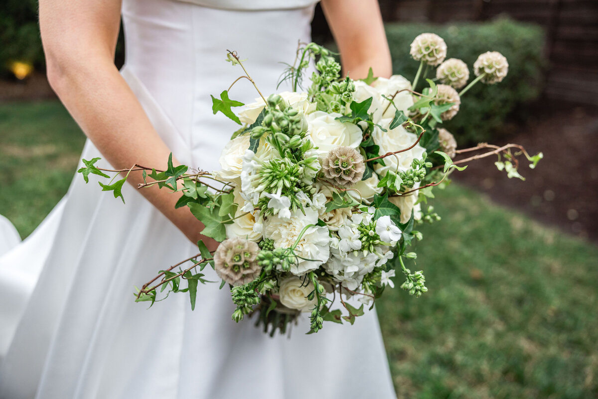 A Nashville bride holding a whimsical bridal bouquet