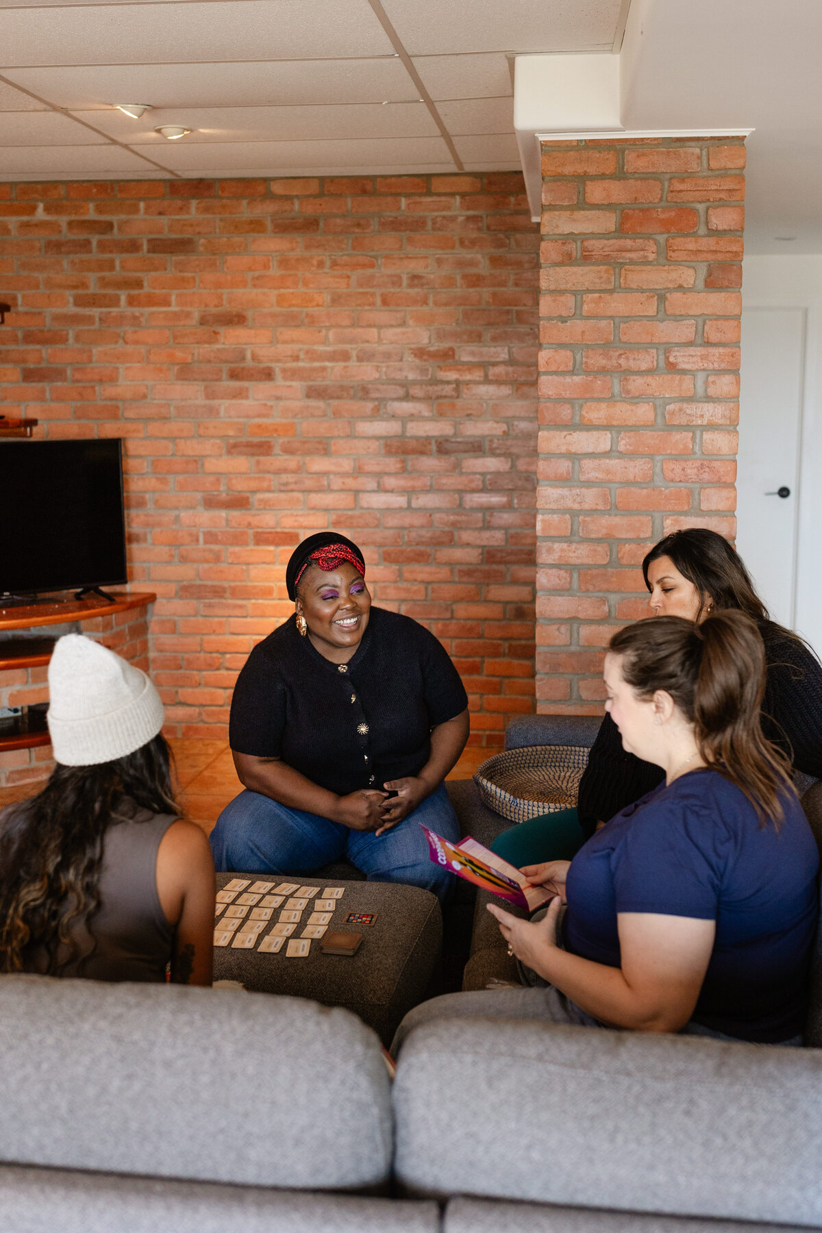 A group of friends playing card games at Ottawa River Beach House