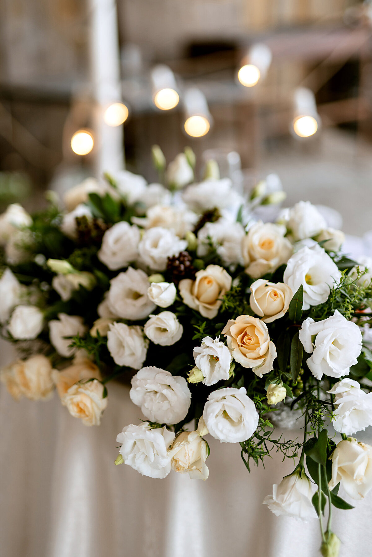 Luxurious floral centerpiece overflowing with lush blooms, creating an elegant and breathtaking table setting, designed by In Full Bloom Event Planning & Design