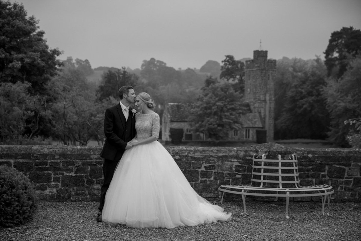 Huntsham Court Wedding Devon Bride and Groom with Church behind