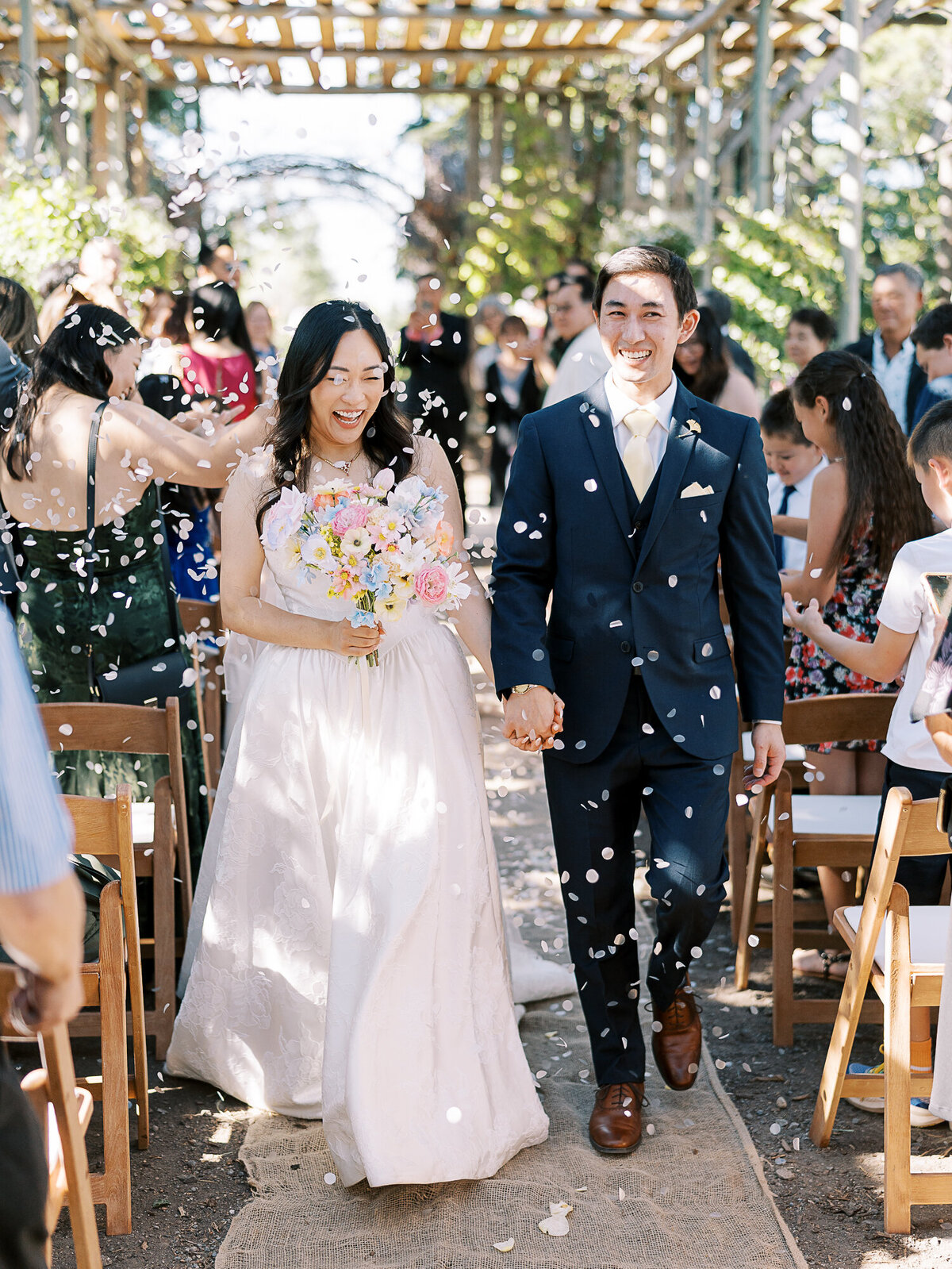 bride and groom down the aisle 