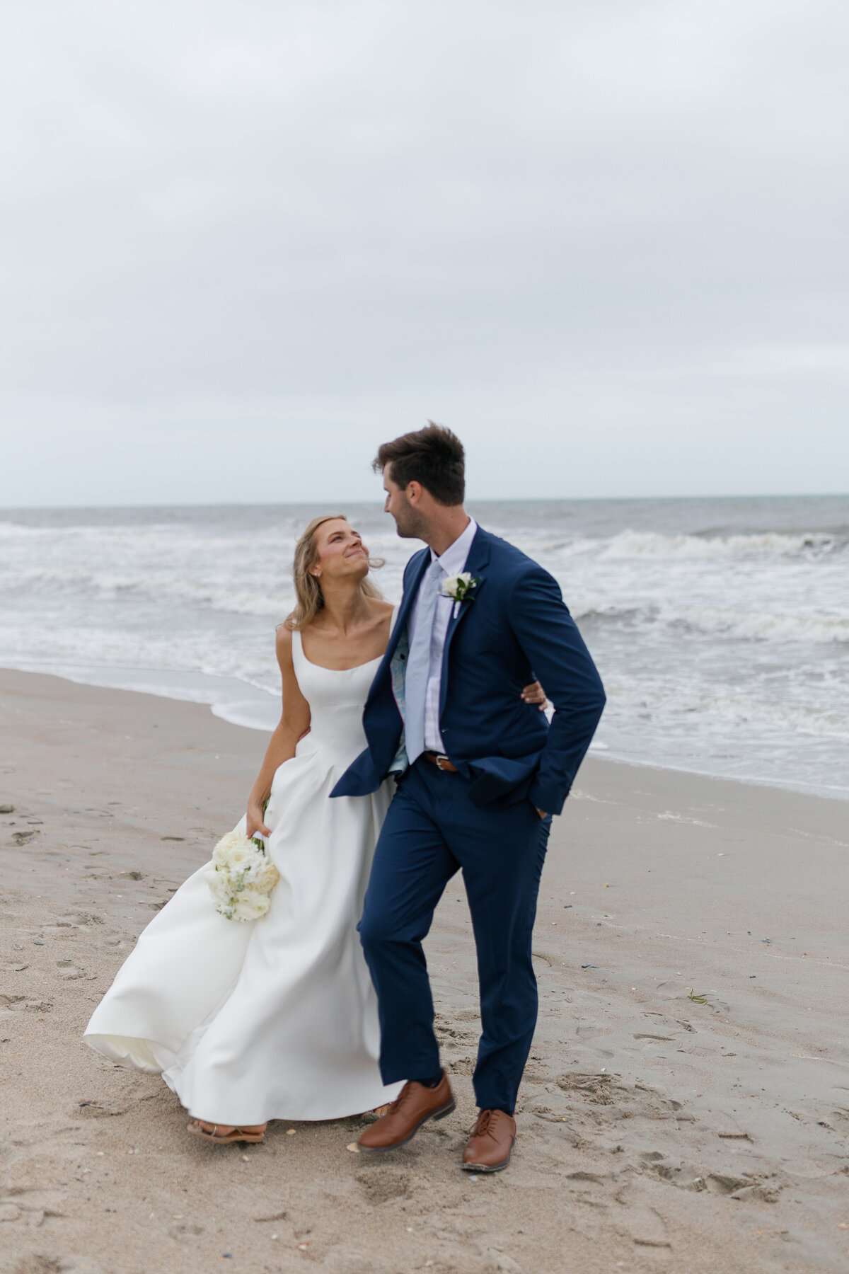 A couple walks in Beaufort North Carolina hand in hand. 