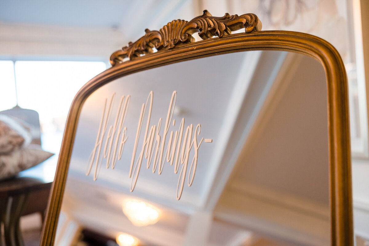 Lettering on gold vintage mirror