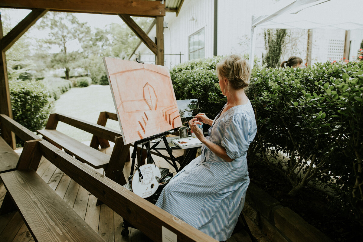 artist creating wedding painting