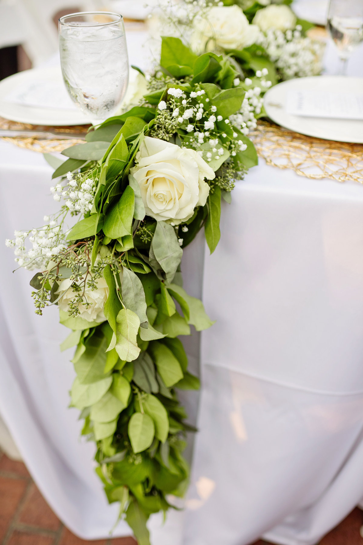 greenery table setting at wedding reception