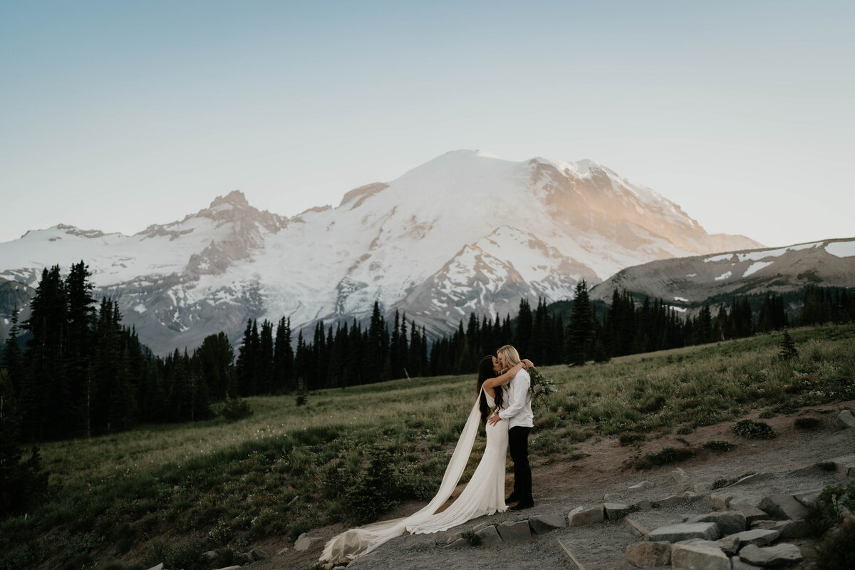 LGBTQ couple sharing a kiss at Mt. Rainier elopement