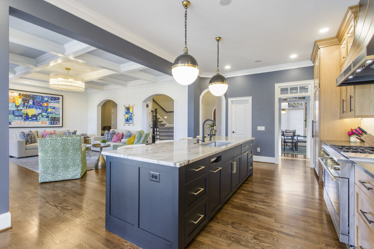 Kitchen island with white countertop and dark stained black cabinets