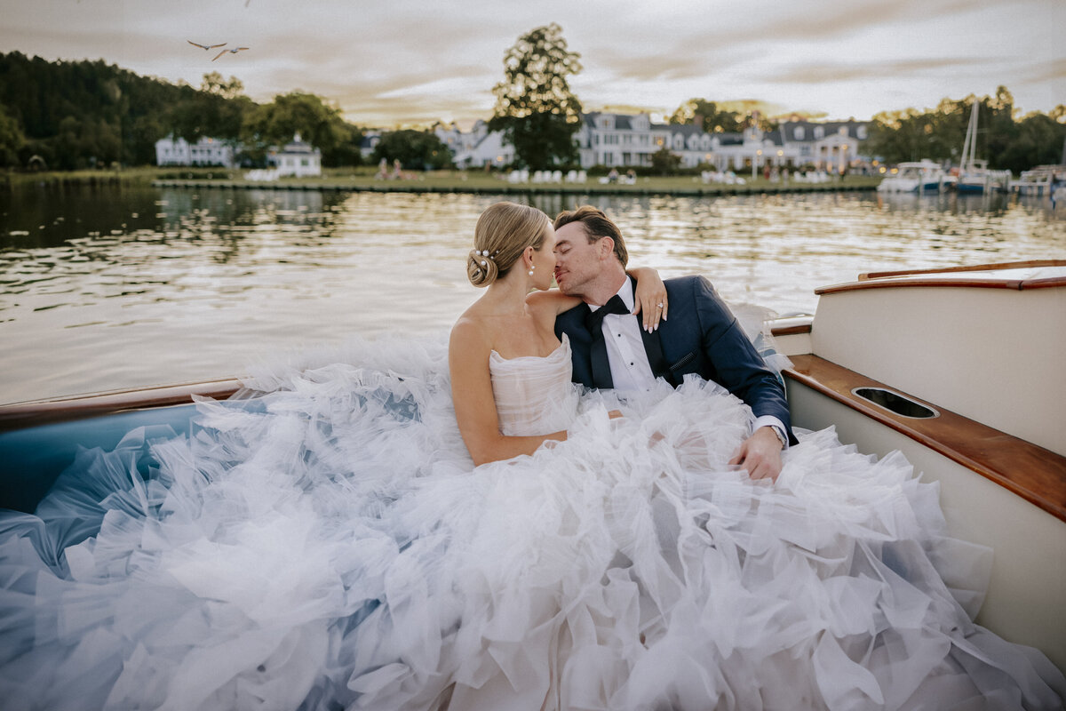 bride-and-groom-intimate-portrait-on-tranquil-boat-at-sunset