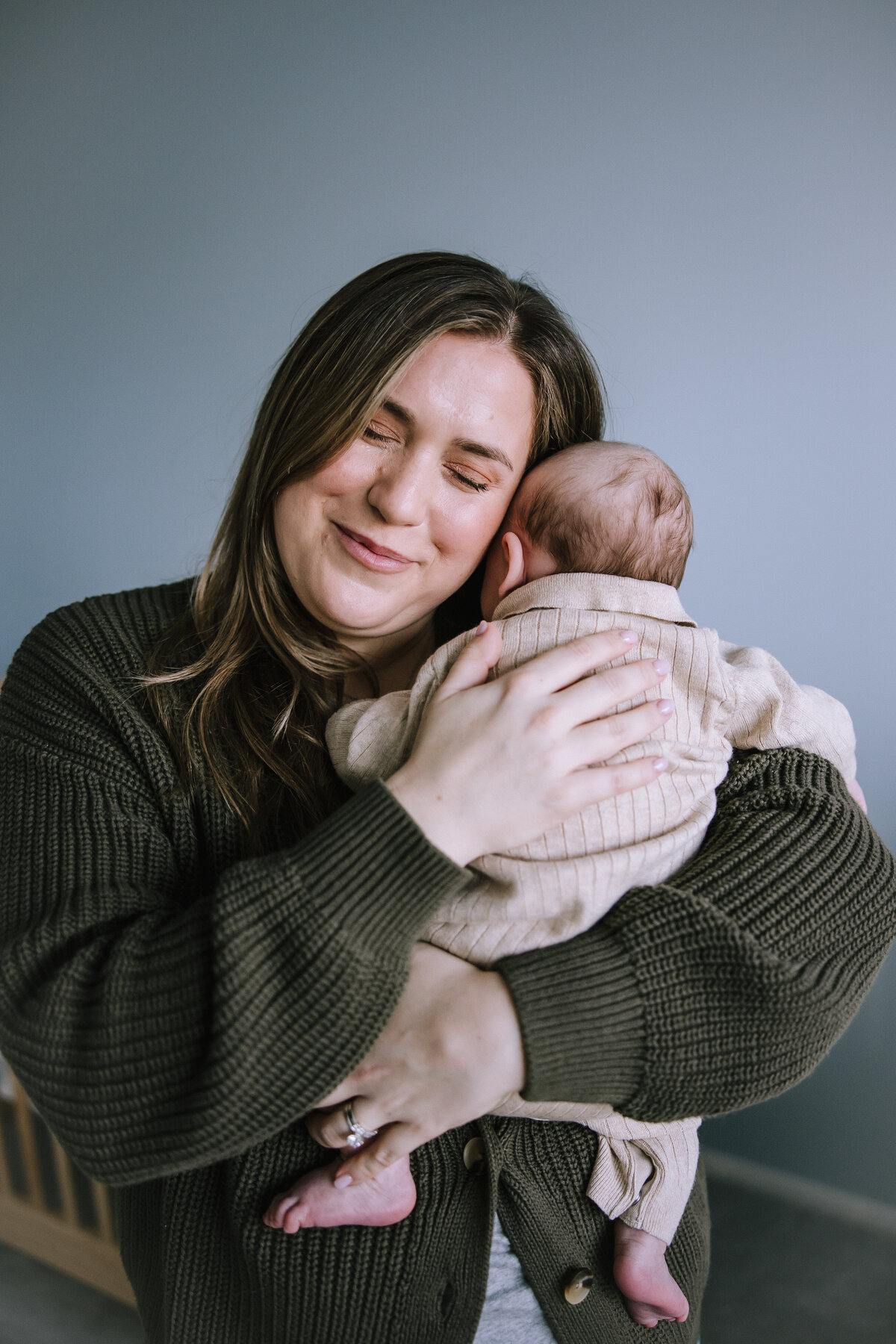Mom with her newborn in her nursery in Pittsburgh. 