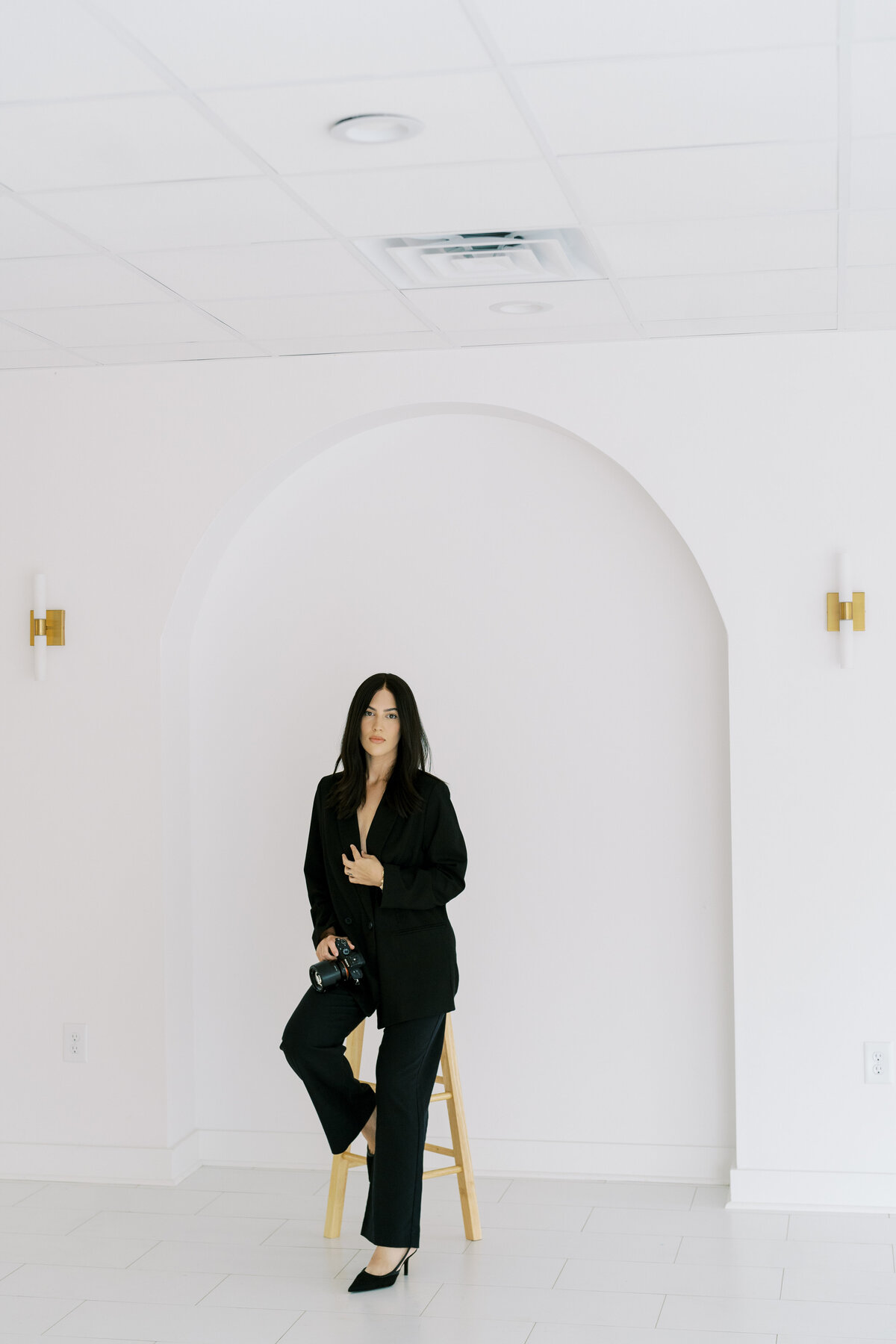 model posing on stool