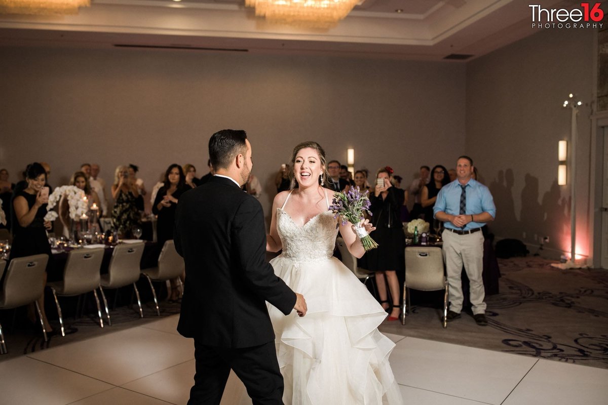Bride and Groom are all smiles before their first dance