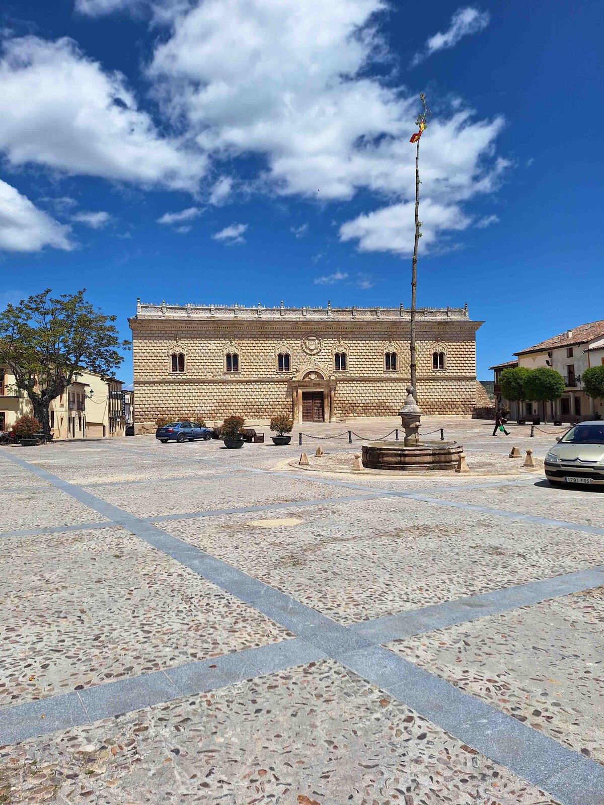 An old building  located in the town near Wine Guide Madrid's Finca Rio Negro winery tour with blue sky and clouds.