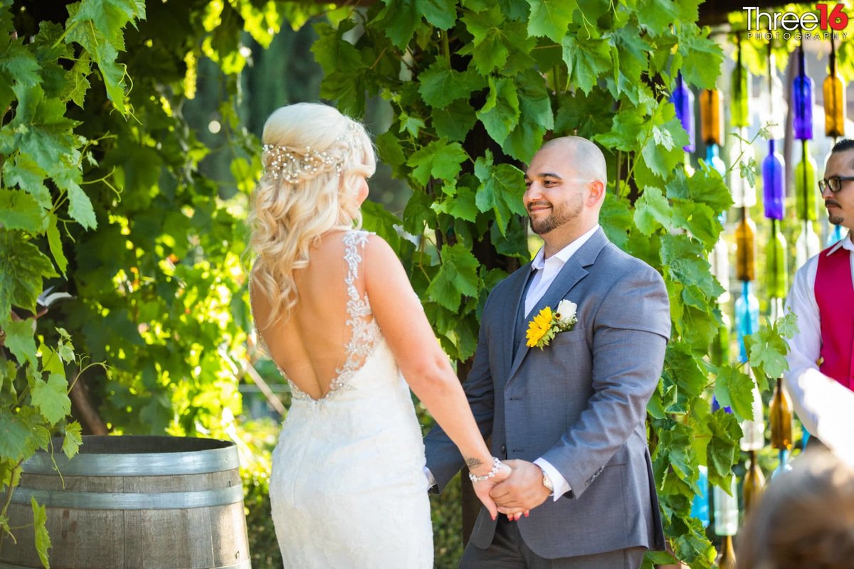 Groom staring at his Bride during wedding ceremony