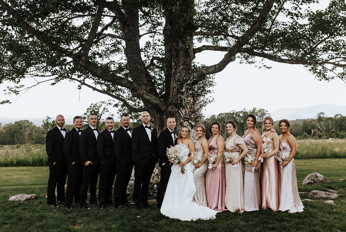 Blush and champagne satin bridal party with dried botanicals