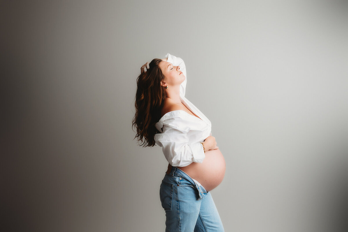 Expectant mother poses for Maternity Photoshoot in Charleston, SC Portrait Studio. 