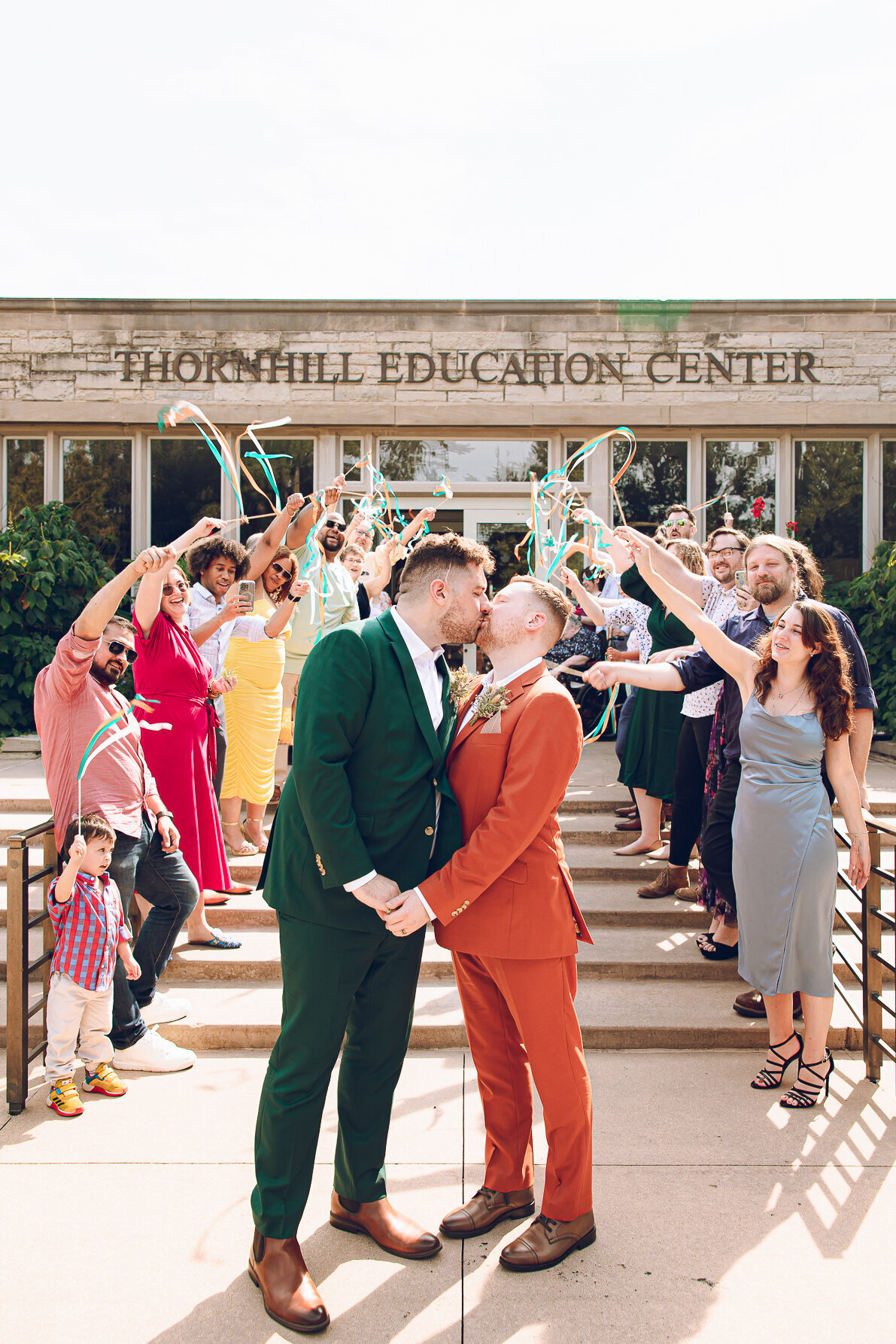 A queer couple has their sendoff on their wedding day at the Morton Arboretum in Lisle Illinois