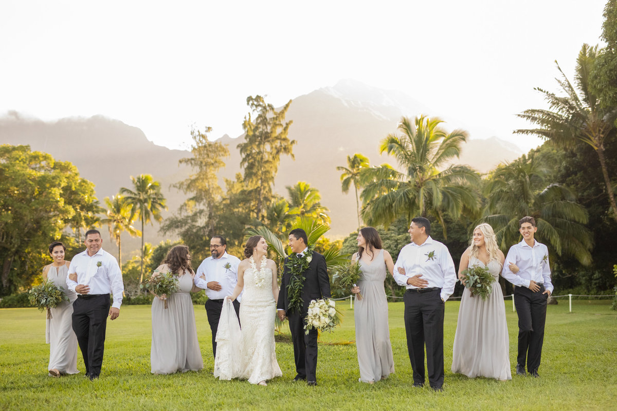 Wedding Photography, Wedding Party walking side by side through the grass