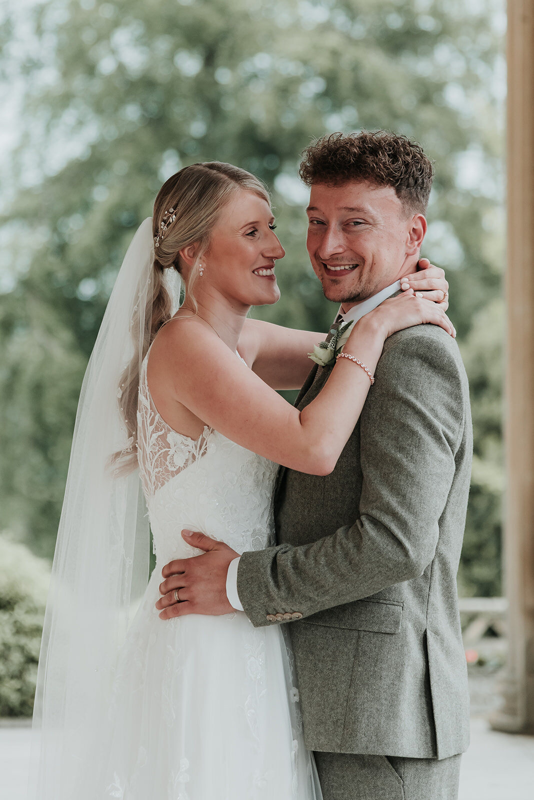 Bride and Groom smiling gently together at their wedding at Buxted Park in East Sussex
