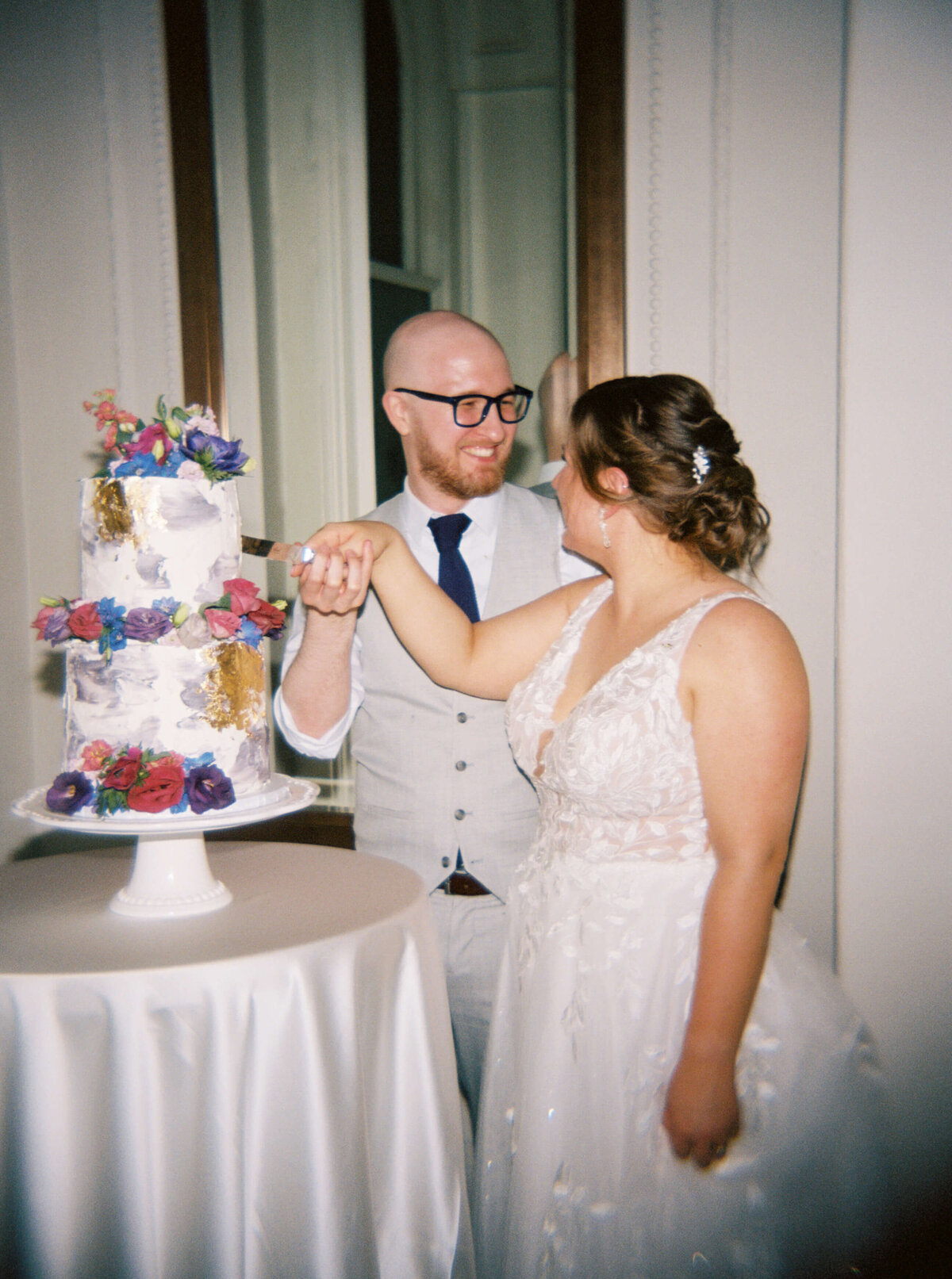 Bride and groom cutting cake at  at Halifax Club wedding in Nova Scotia
