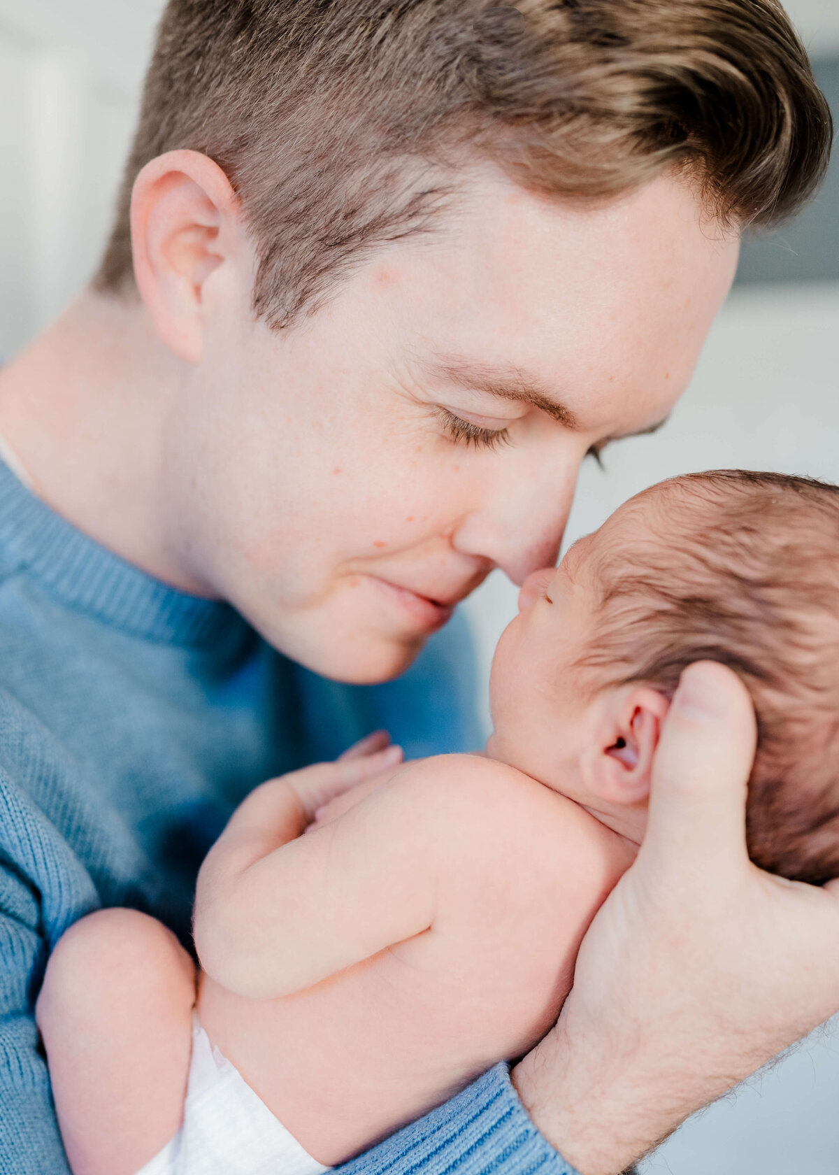 Natural newborn portraits in San Ramon home using soft, neutral tones.