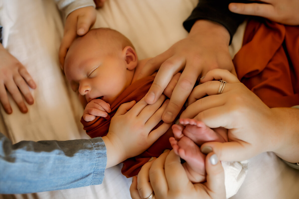 Family touching newborn baby | Joshua, TX Newborn Photographer