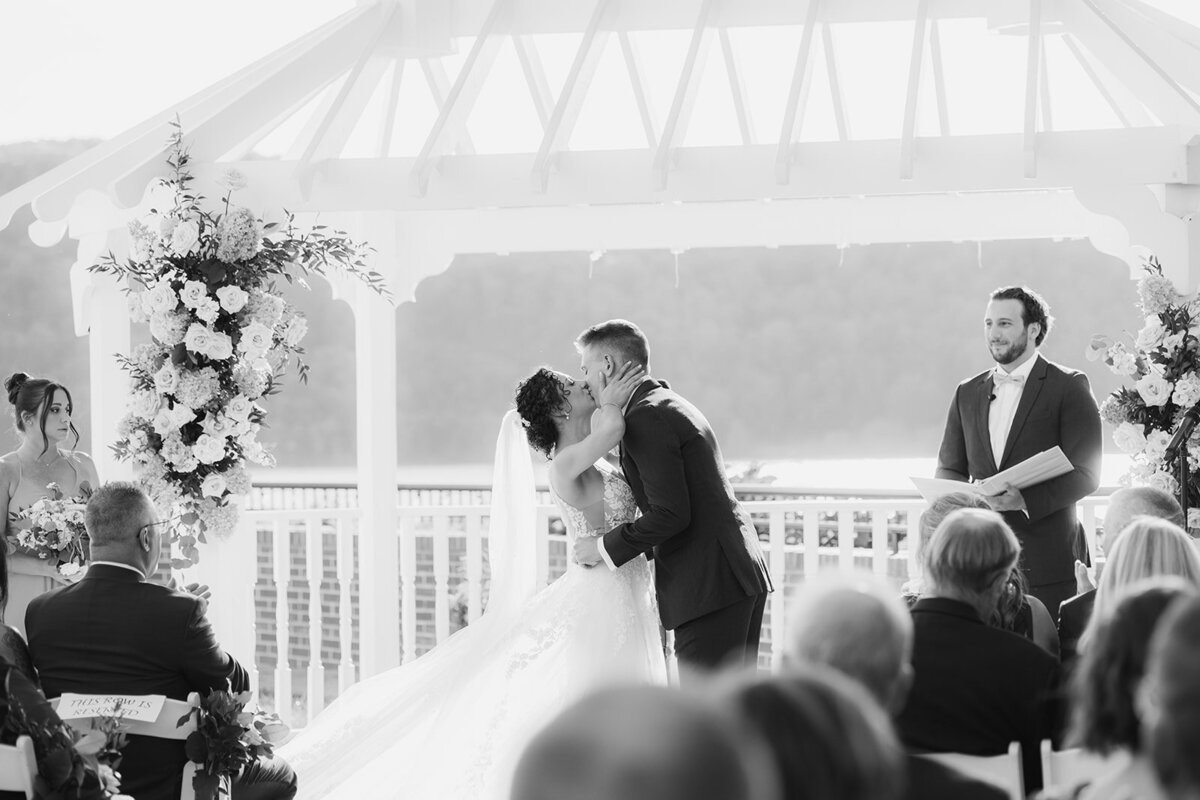poignant first kiss during summertime wedding in the hudson valley