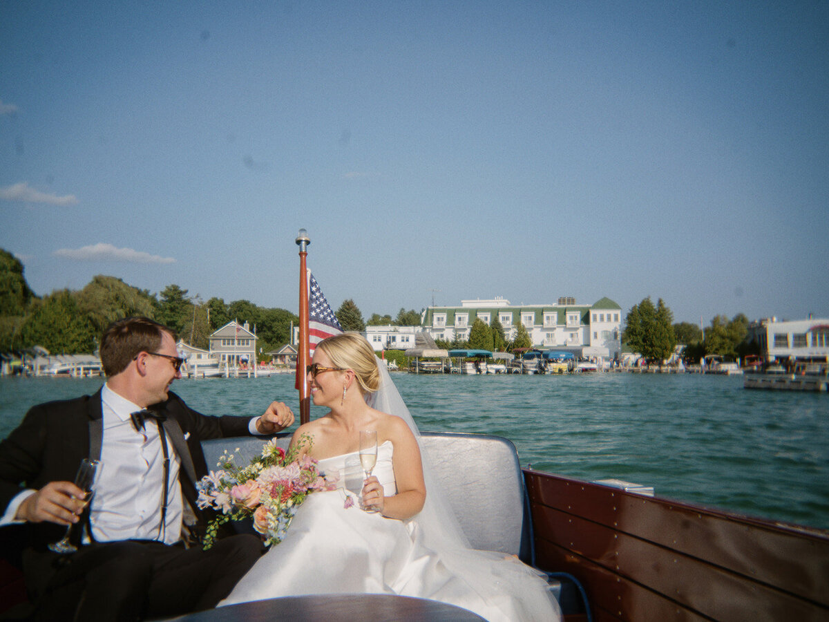 Bride and ground share their vows in a formal ceremony surrounding by loved ones.