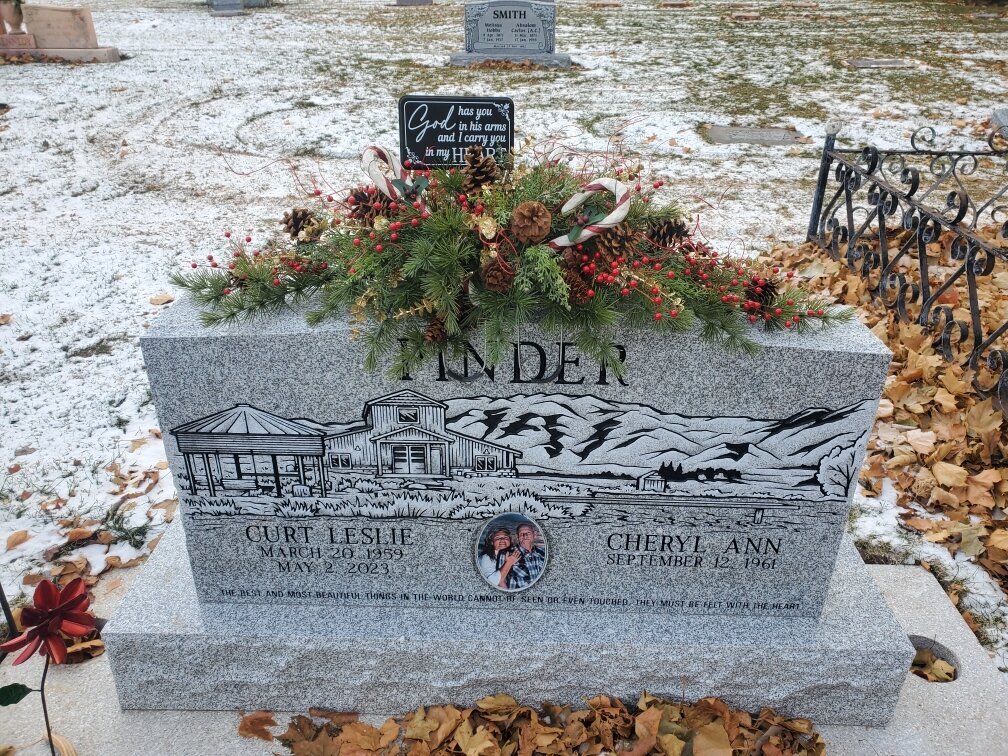 silk arrangement for the top of a headstone for the winter season