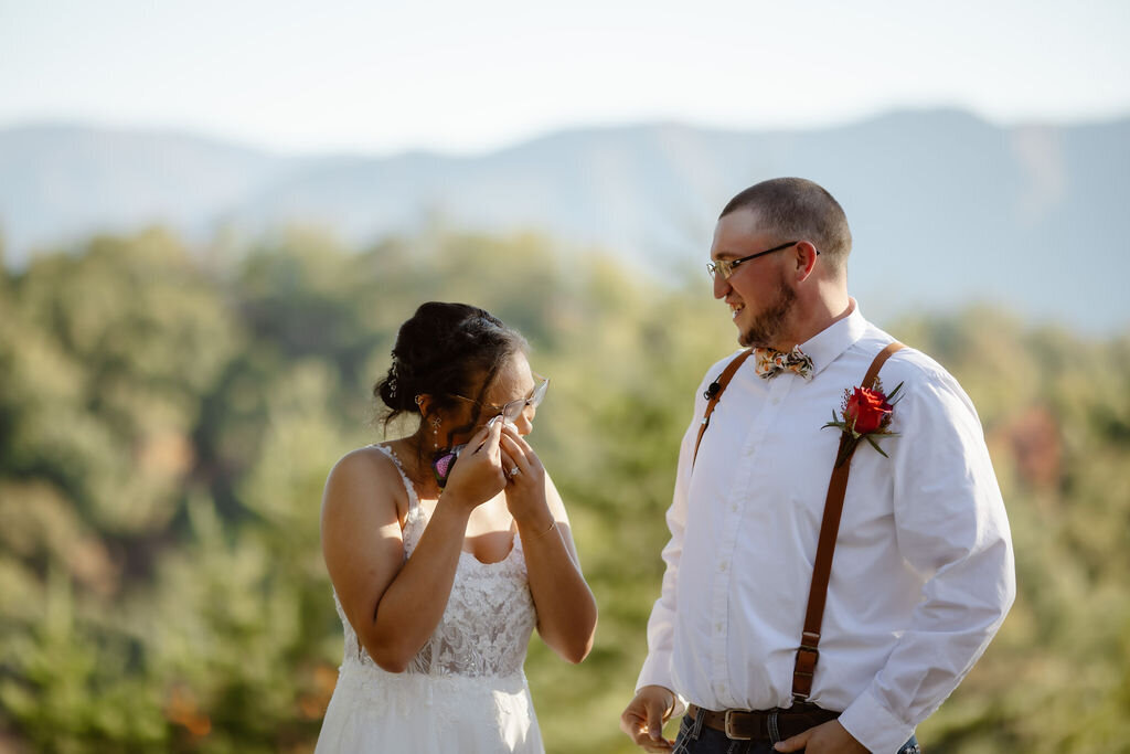 candid wedding photos by Gatlinburg photographer with bride crying after their Foothills ceremony at sunset 