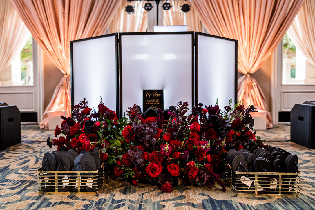 dancing shoes, champagne drapery, flip flops, signage, red flowers, ground arrangements, 