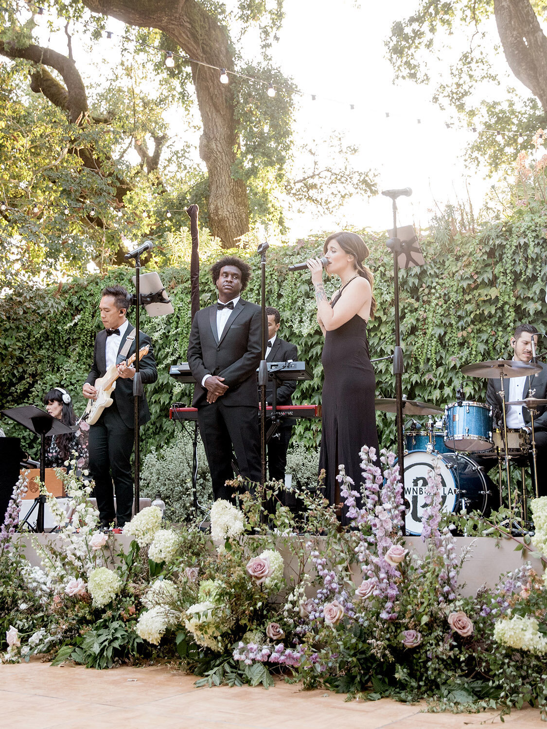 annadel-estate-elegant-sonoma-winery-wedding-band-floral-stage-skirting