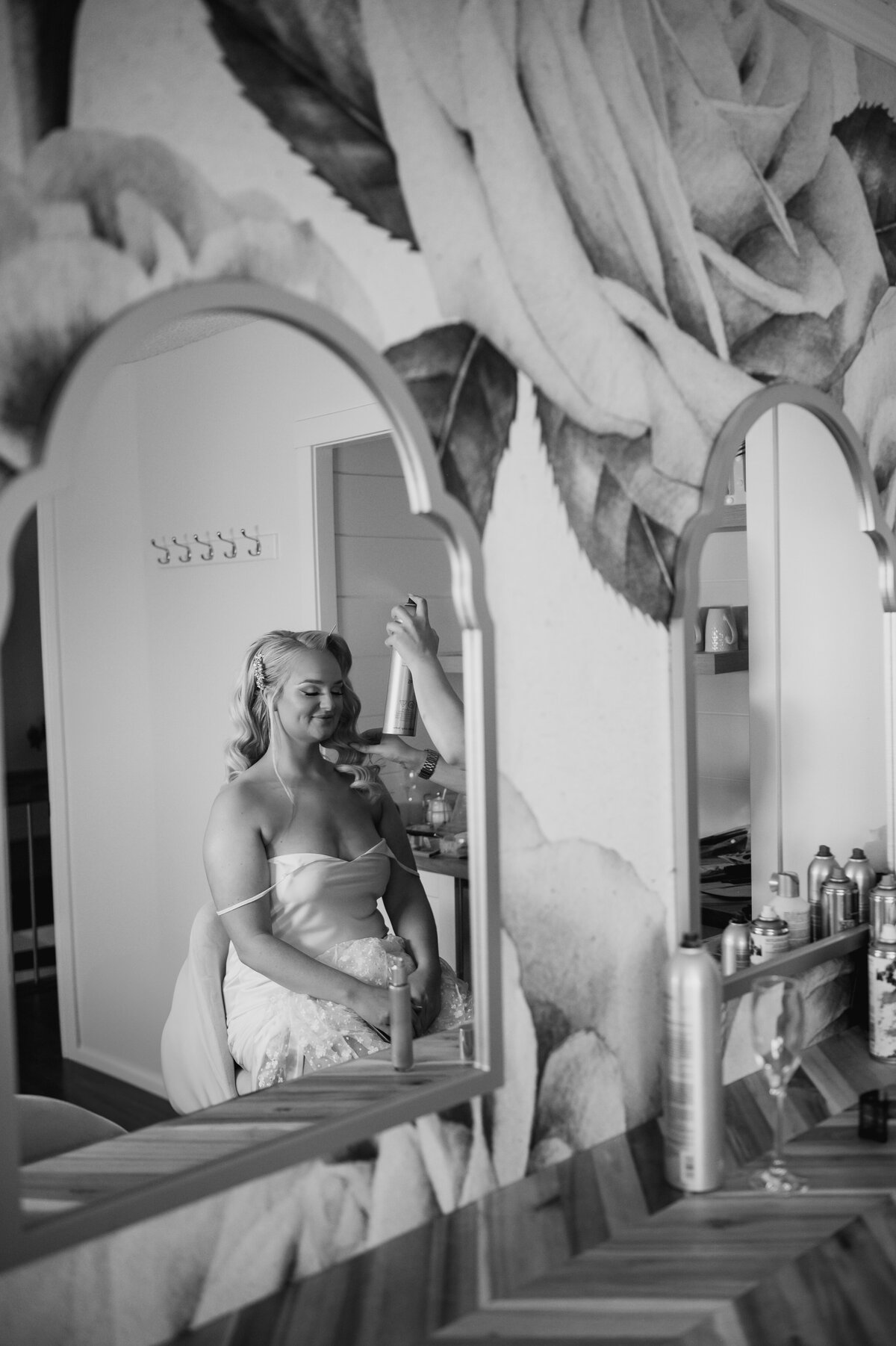 bride getting ready, photographed through mirror