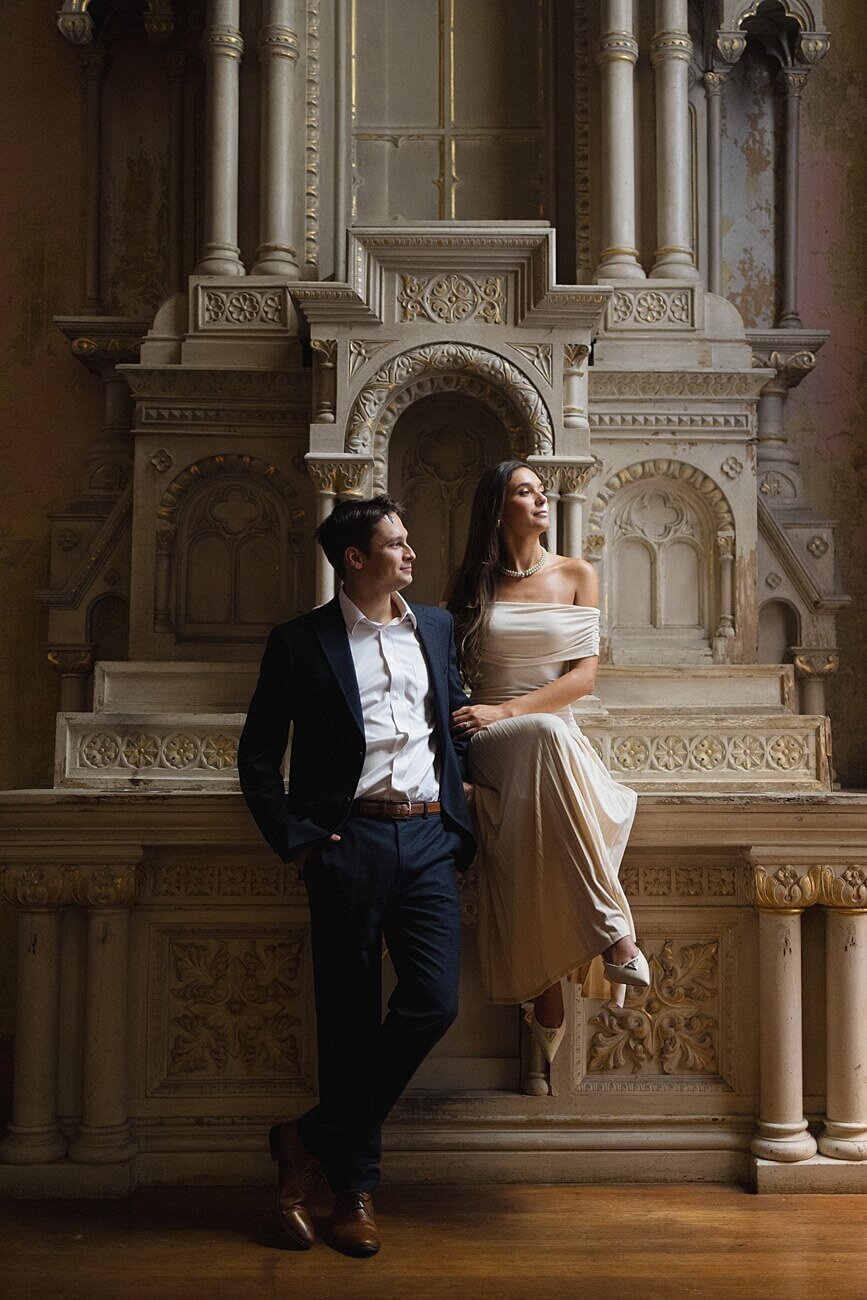 Couple sitting on mantle at Hotel Peter and Paul