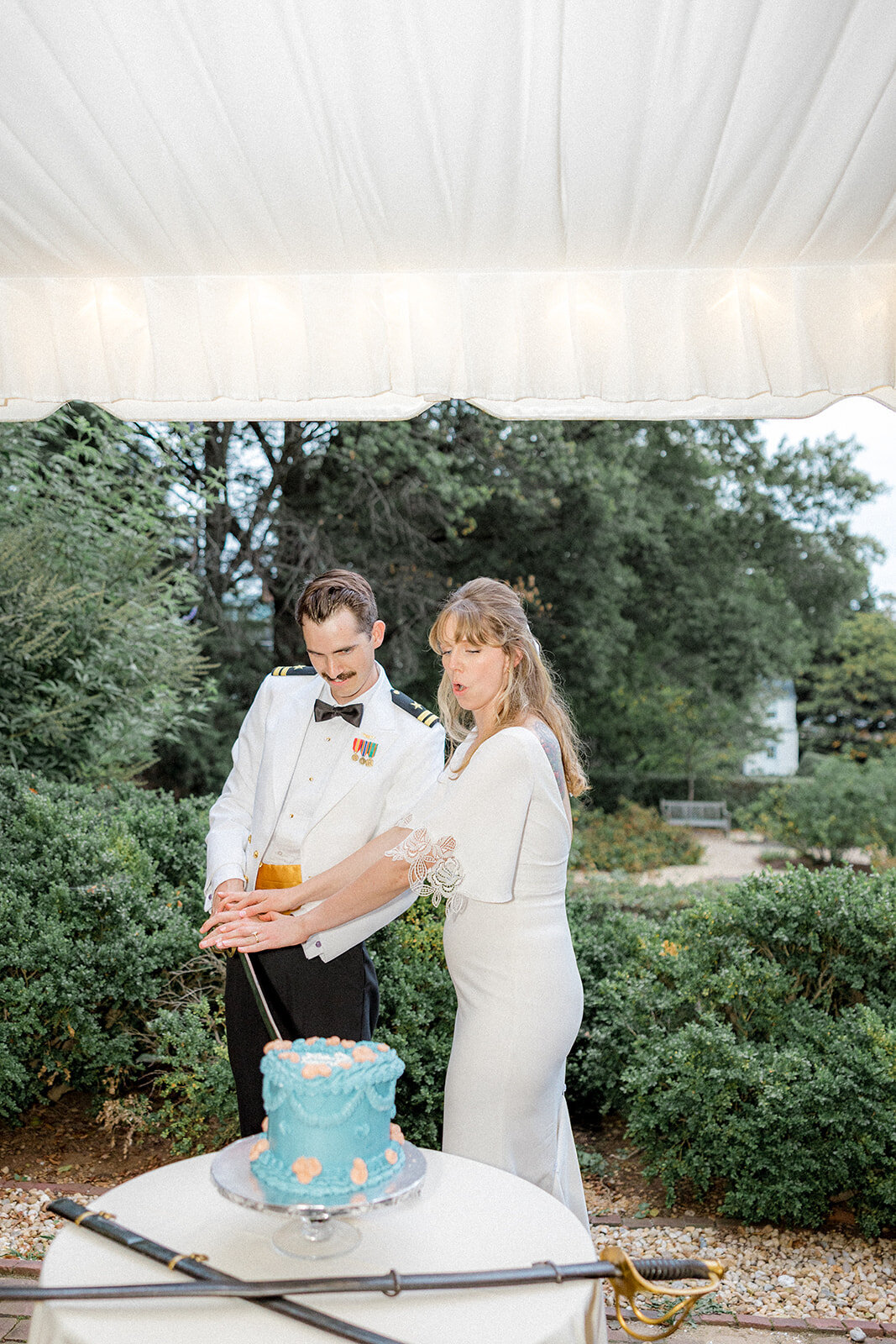 Bride and groom cutting their wedding cake