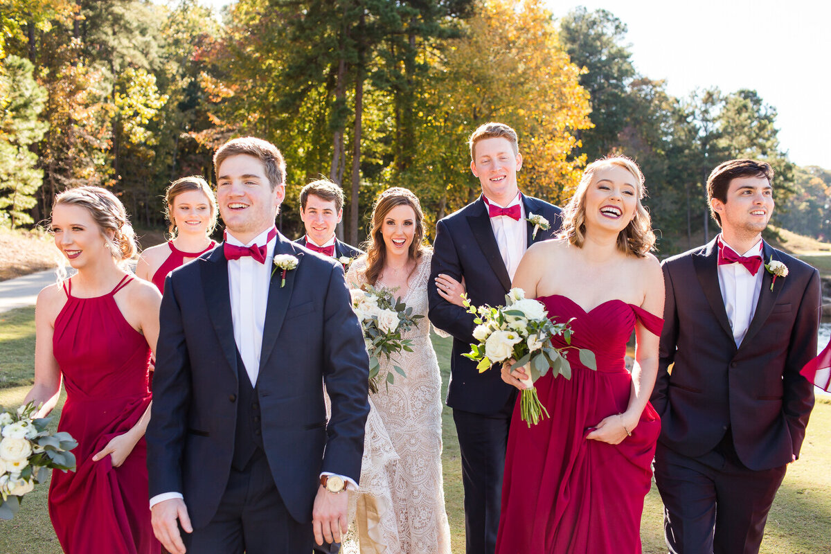 wedding party having fun at lake lanier in the fall