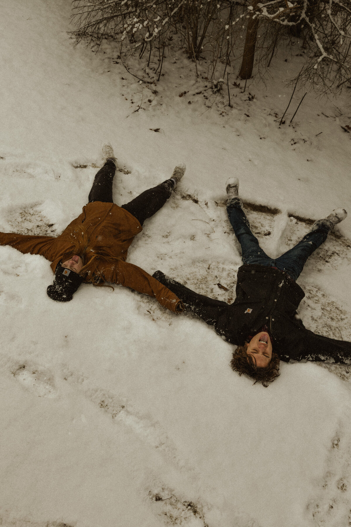 Couple Making Snow Angles | MN Photographer 