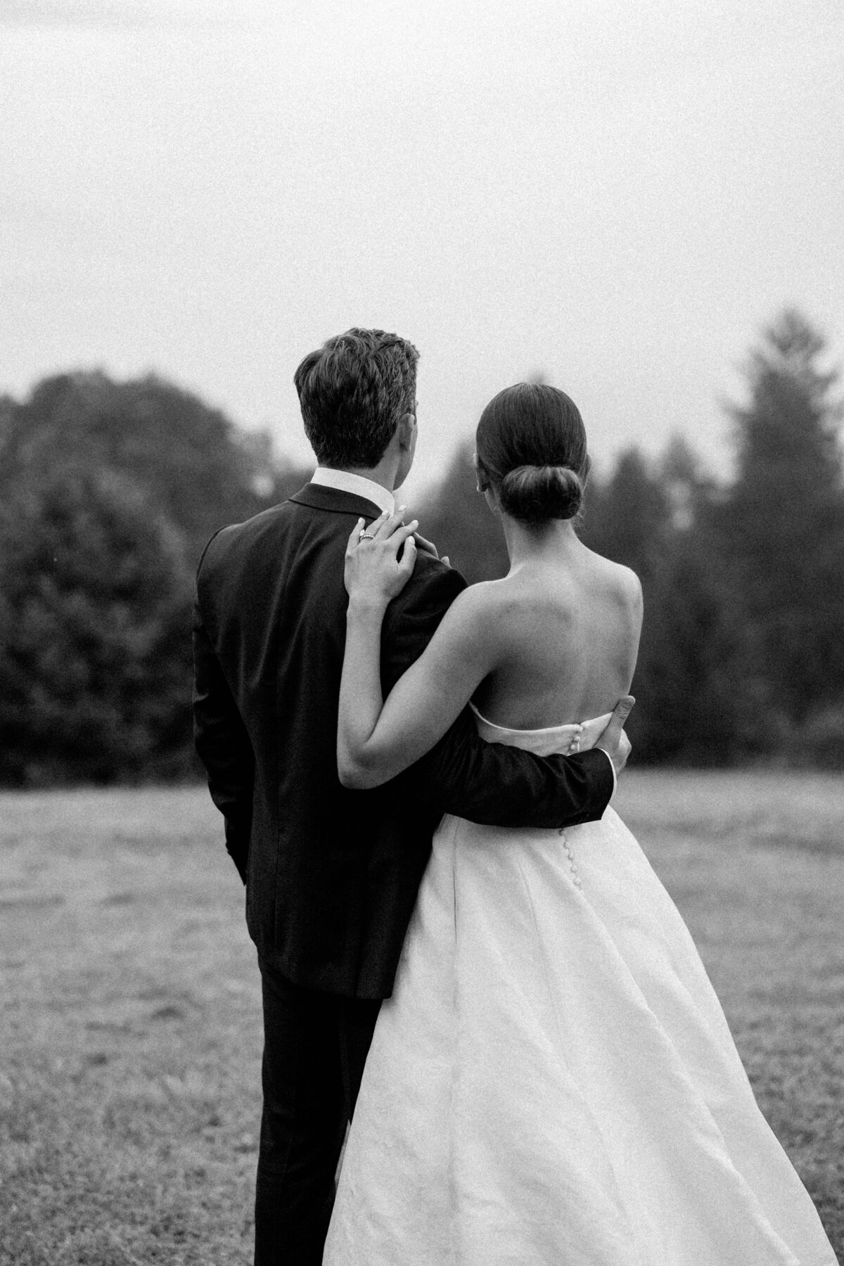 couple looking out the mountains after wedding